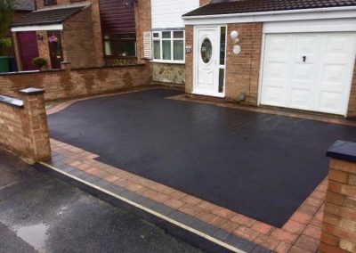 Block paving border with tarmac