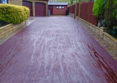 Long red tarmac driveway