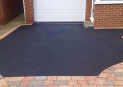 Mixture of tarmac driveway with block paving