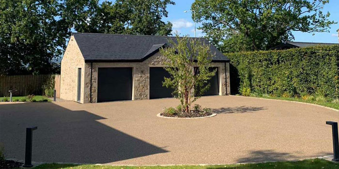 Patterned block paving with tarmac driveway